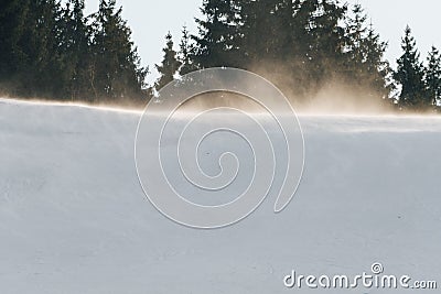 Strong wind gust at the top of the ski slope Stock Photo