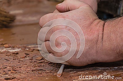 Strong working hands doing repairs. Stock Photo