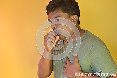 Strongly coughing young man suffered from asthma Stock Photo