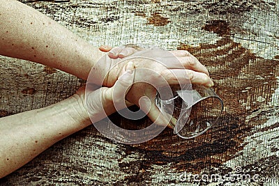 Strongly trembling hands of an older woman Stock Photo