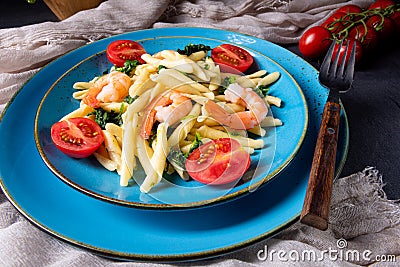 Strozzapreti pasta with spinach and shrimp Stock Photo