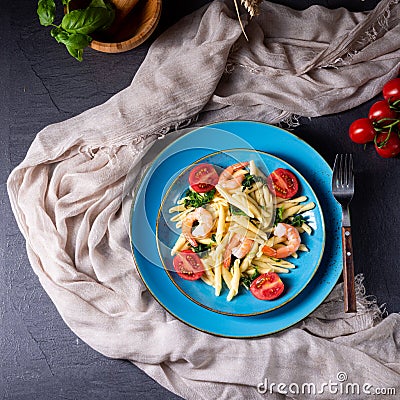 Strozzapreti pasta with spinach and shrimp Stock Photo