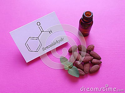 Structural chemical formula of benzaldehyde with almond oil. Benzaldehyde is naturally found in almonds. Stock Photo