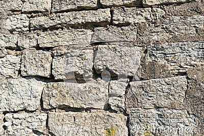 Structural masonry from natural stone of an old fortress wall. Stock Photo
