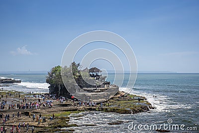 Structure of rock construction standing on the seashore in beautiful sunny day with the view of horizon in Tanah lot, Bali Editorial Stock Photo