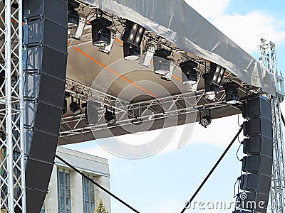 Structures of stage illumination spotlights equipment and speakers Stock Photo