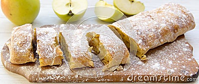 Strudel or apple pie on wooden board, side view. Stock Photo