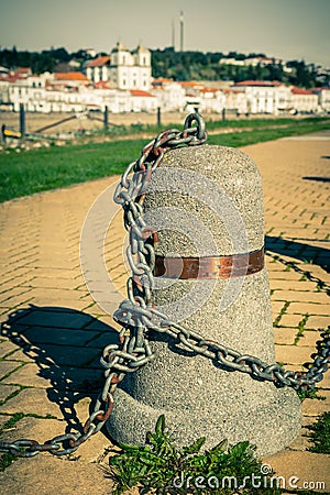 Stub posts linked in a chain on a quay Stock Photo