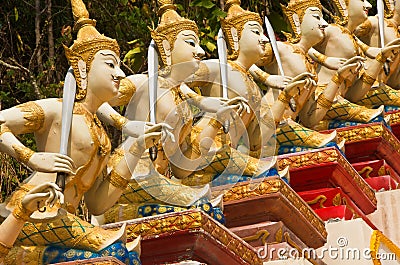 Stucco angels holding a sword. Stock Photo