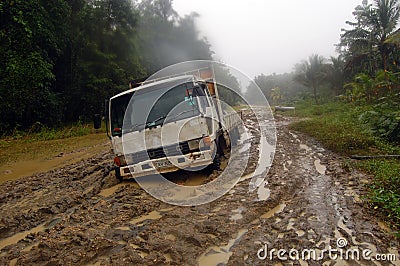 Stuck truck at muddy road Editorial Stock Photo
