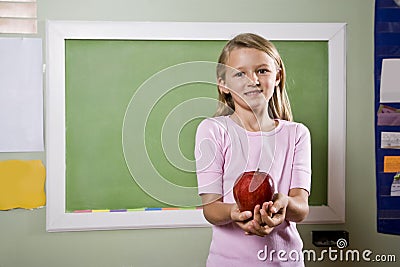 Student with apple for teacher Stock Photo