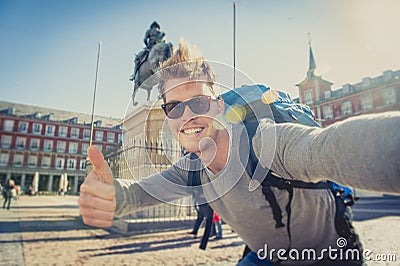 Student backpacker tourist taking selfie photo with mobile phone outdoors Stock Photo