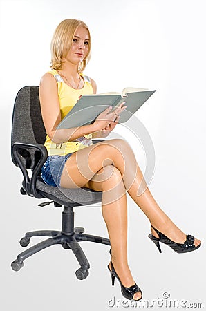Student with the book on a chair Stock Photo
