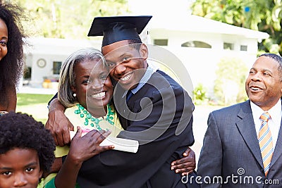 Student Celebrates Graduation With Parents Stock Photo