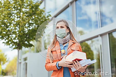 Student during covid-19 cannot enter closed university building Stock Photo