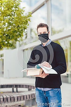 Student during covid-19 cannot enter closed university building Stock Photo