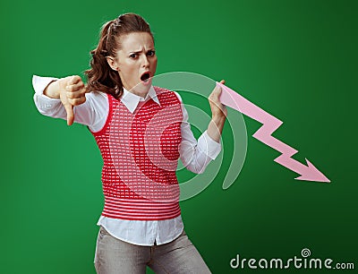 Student with falling down graphics arrow showing thumbs down Stock Photo