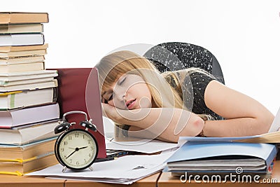 Student fell asleep at his desk preparing for an exam Stock Photo