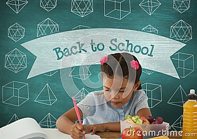 Student girl at table writing against blue blackboard with back to school text and education and sch Stock Photo