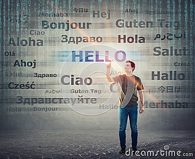 Student guy pointing index finger up choosing word hello with different translations. Multilingual teacher learning and speaking Stock Photo