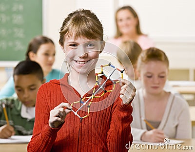 Student holding helix in classroom Stock Photo