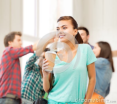 Student holding take away coffee cup in college Stock Photo