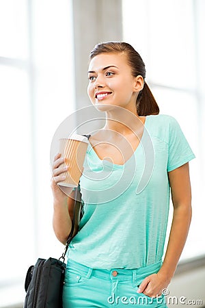 Student holding take away coffee cup Stock Photo