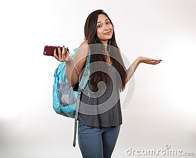 Student Holds Phone and Shrugs Shoulders Stock Photo