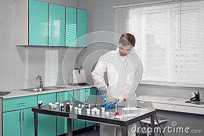 Student in the lab. Young male chemist working in the laboratory Stock Photo