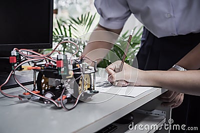 Student learning STEM Education robotics for creating project based studying for innovation robot model. New study generation for Stock Photo