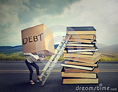 Student loan debt. Woman with heavy box debt carrying it up education ladder Stock Photo