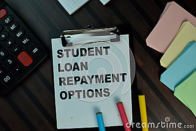 Student Loan Repayment Options write on a paperwork isolated on Wooden Table. Educational concept Stock Photo