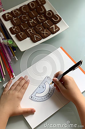 A student makes lessons. School supplies. Editorial Stock Photo