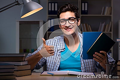 The student preparing for exams late night at home Stock Photo