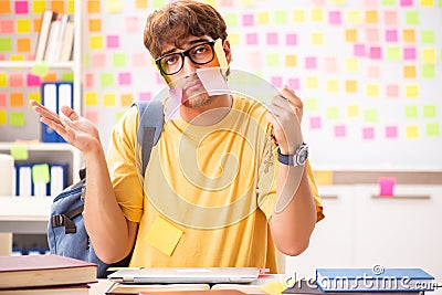 The student preparing for exams with many conflicting priorities Stock Photo