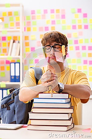 The student preparing for exams with many conflicting priorities Stock Photo