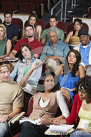 Student Raising Hand To Answer Stock Photo