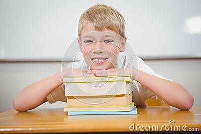 Student resting thie head upon some books Stock Photo