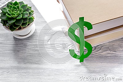 Student`s desk with dollar sign for fee-paying education set gray background Stock Photo