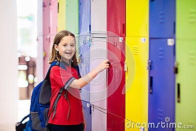 Student in school at locker. Kids in preschool Stock Photo