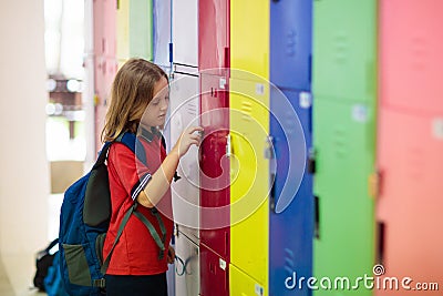 Student in school at locker. Kids in preschool Stock Photo
