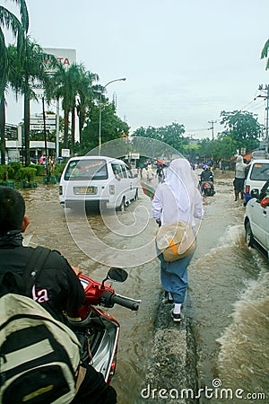 Crossing a Flooded Road Editorial Stock Photo