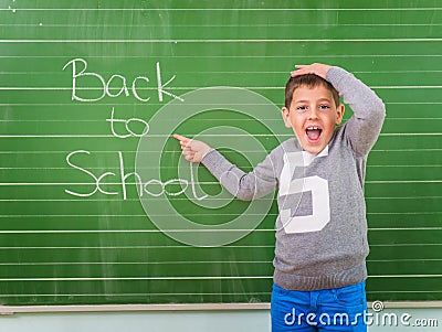 Student shows a board with the inscription: Back to School Stock Photo