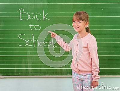 Student shows a board with the inscription: Back to School Stock Photo