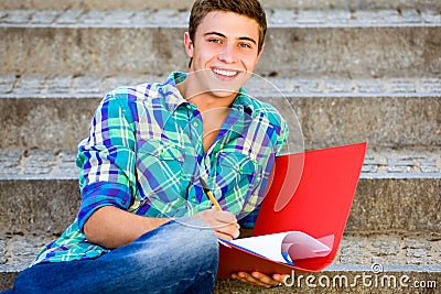 Student sitting on stairs Stock Photo