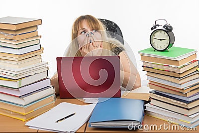 Student stayed on night at the computer and was horrified to look at the clock Stock Photo