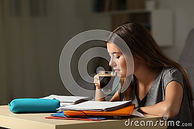 Student studying drinking coffee late hous Stock Photo