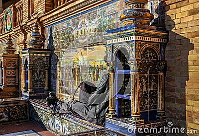 Siesta in the sun at the Plaza de Espana in Seville, Spain. Editorial Stock Photo