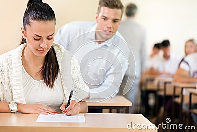 Student trying to cheat at test Stock Photo