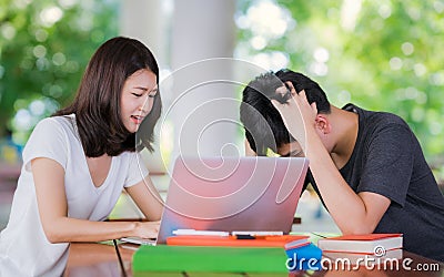 Student tutor teach her friend before examinatuin in out door li Stock Photo